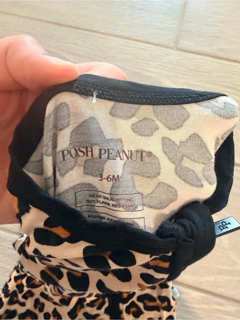 Posh Peanut Leopard Print One-Piece Footie with Black Trim